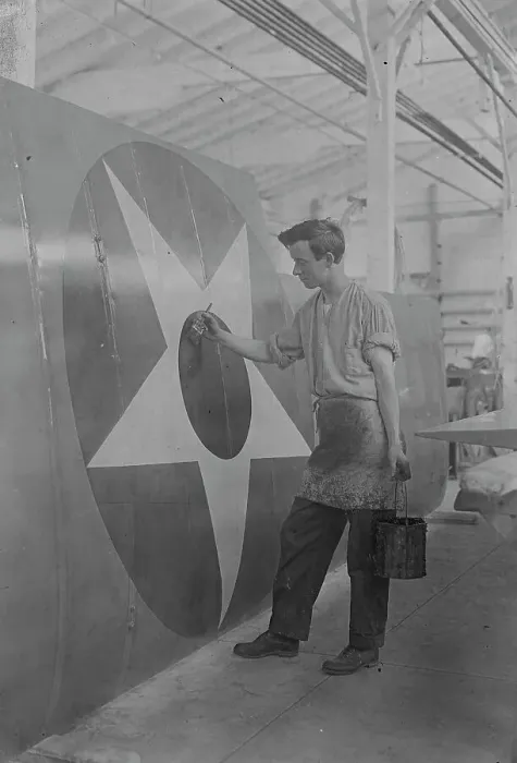 Framed Print : Putting U.S. Emblem on plane, between c1915 and c1920. Creator: Bain News Service Framed Print : Putting U.S. Emblem on plane, between c1915 and c1920. Creator: Bain News Service