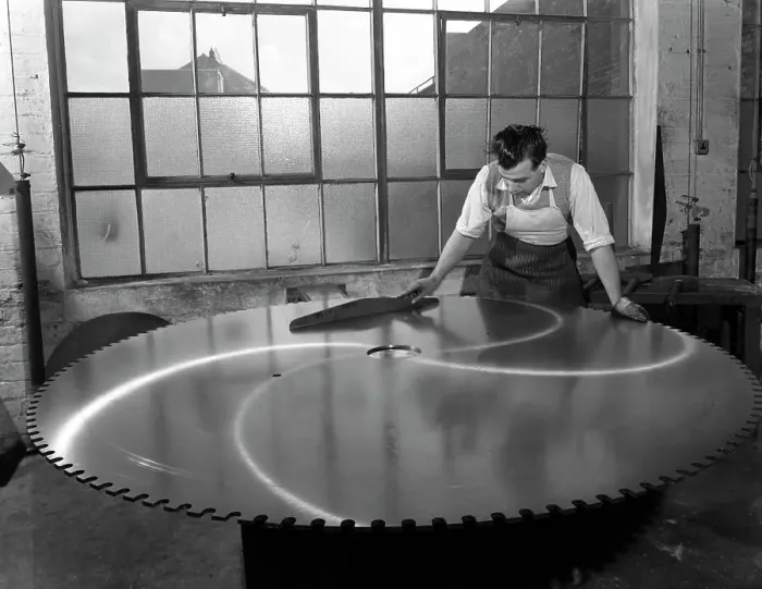 Framed Print : Quality checking a giant saw blade, Edgar Allens steel foundry, Sheffield, South Yorkshire, 1963 Framed Print : Quality checking a giant saw blade, Edgar Allens steel foundry, Sheffield, South Yorkshire, 1963