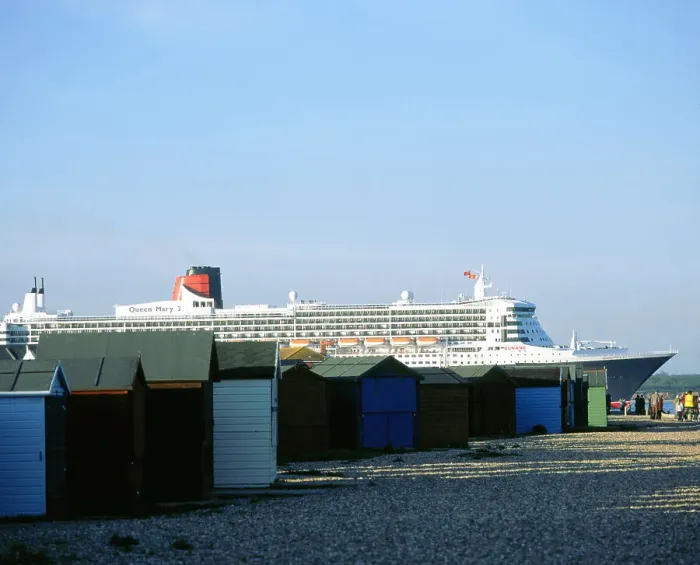 Framed Print : Queen Mary II sails past Beach Huts, Calshot May 2004 Framed Print : Queen Mary II sails past Beach Huts, Calshot May 2004