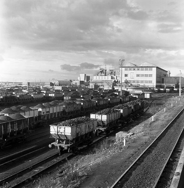 Rail trucks loaded with coal leaving Lynemouth Colliery, Northumberland, 1963. Artist