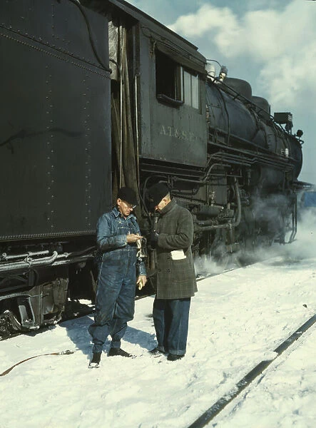 Railroad conductor George E. Burton and engineer J.W. Edwards... Chicago, Ill. 1943. Creator: Jack Delano
