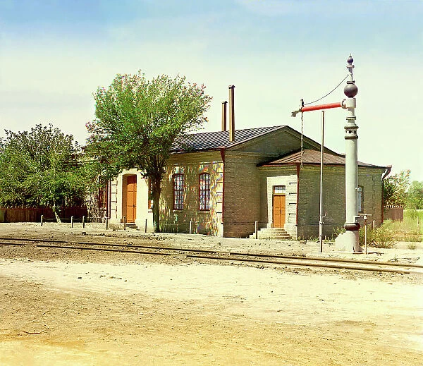 Railroad station with water crane and tracks, between 1905 and 1915. Creator: Sergey Mikhaylovich Prokudin-Gorsky