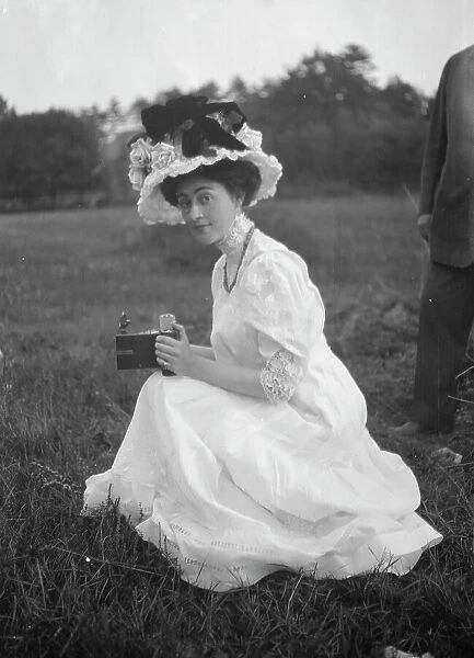 Rainsford, Mrs. seated outdoors, between 1922 and 1924. Creator: Arnold Genthe