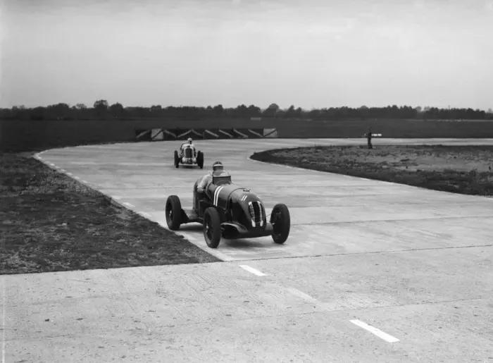 Framed Print : Rapier Special Racing single seater leading a MG in a race on the Campbell Circuit at Brooklands Framed Print : Rapier Special Racing single seater leading a MG in a race on the Campbell Circuit at Brooklands