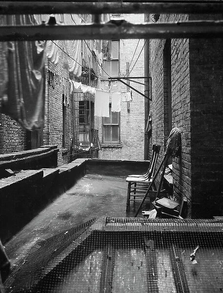 Out of rear window tenement dwelling of Mr and Mrs Jacob Solomon, 133 Avenue D, New York City, 1936. Creator: Dorothea Lange