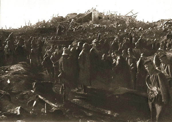 In Recaptured Territory; The evening of October 23, 1917: gathering German prisoners, ... 1917. Creator: Unknown