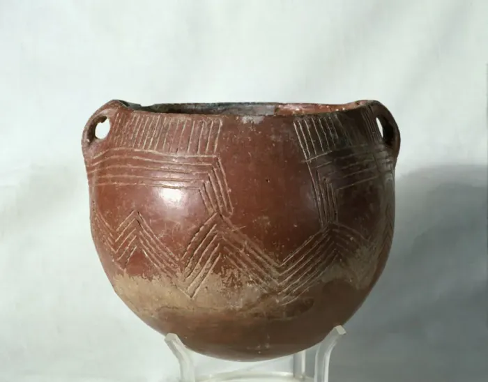 Framed Print : Red ochre glass (painted with a red slip of iron oxide), with incised parallel lines Framed Print : Red ochre glass (painted with a red slip of iron oxide), with incised parallel lines