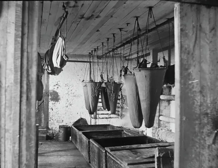 Framed Print : In the refining room filtering sea elephant oil, c1895. Creator: Unknown Framed Print : In the refining room filtering sea elephant oil, c1895. Creator: Unknown