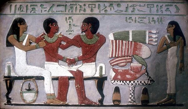Relief of Imn-Hat seated with his wife & son in front of an offering, Thebes, c2050-c1786 BC