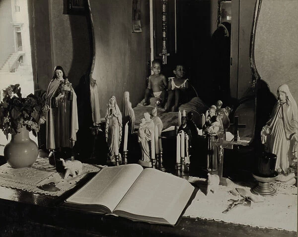 Religious objects and an improved altar in the bedroom of Mrs. Watson... Washington, D.C. 1942. Creator: Gordon Parks