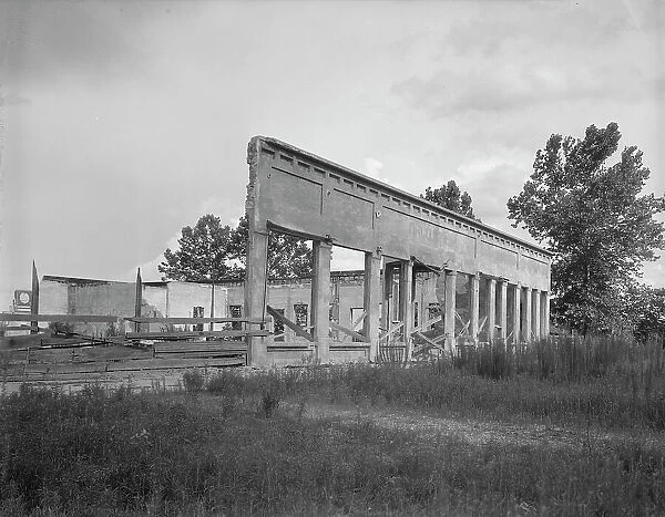 Remains of storefronts in Fullerton, Louisiana, an abandoned lumber town, 1937. Creator: Dorothea Lange