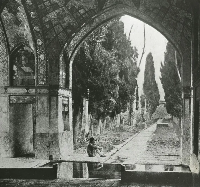 Framed Print : Reproduction of print showing Garden at Fin-Nahe¯, Kashan, Iran. Man seated under arch, c1920. Creator: Frances Benjamin Johnston Framed Print : Reproduction of print showing Garden at Fin-Nahe¯, Kashan, Iran. Man seated under arch, c1920. Creator: Frances Benjamin Johnston