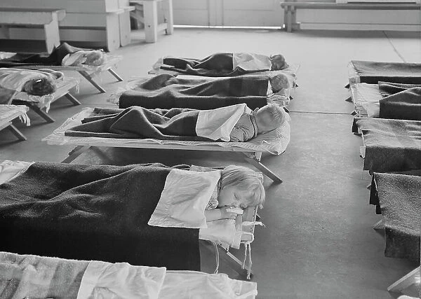 Rest time in nursery school for migrant children at Shafter Camp, California, 1939. Creator: Dorothea Lange