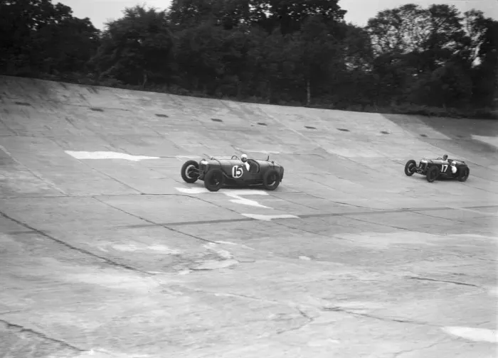 Framed Print : Two Riley 9 Brooklands racing on the banking at a JCC Members Day, Brooklands. Artist: Bill Brunell Framed Print : Two Riley 9 Brooklands racing on the banking at a JCC Members Day, Brooklands. Artist: Bill Brunell