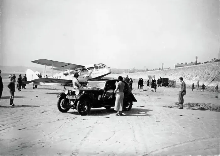 Framed Print : Riley Kestrel and a Dragon aircraft on a beach, 1934 Framed Print : Riley Kestrel and a Dragon aircraft on a beach, 1934