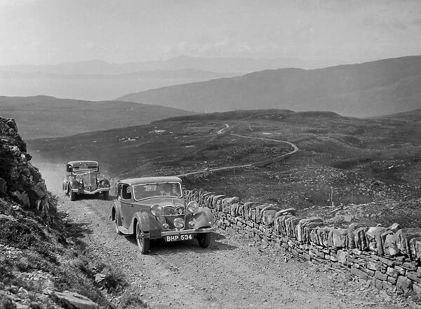 Riley of Miss F Walker leading a Hudson Eight at the RSAC Scottish Rally, 1936. Artist
