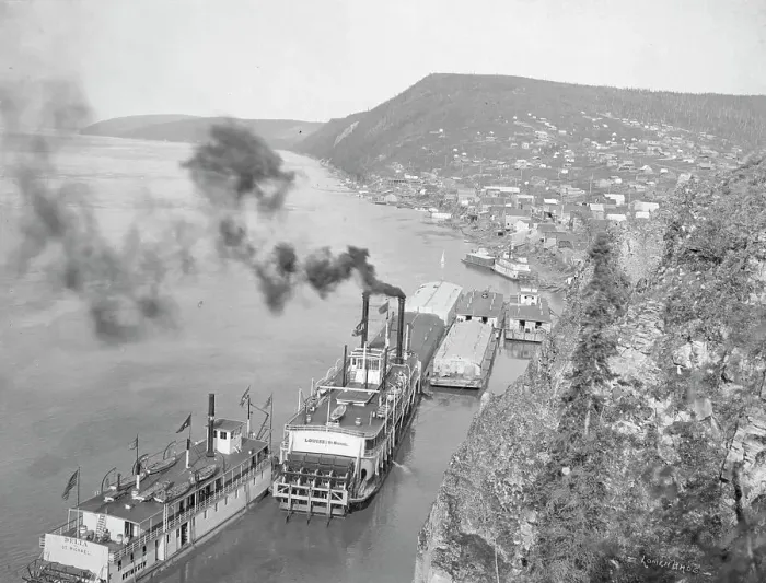 Framed Print : Riverboats distant view of town, between c1900 and 1923. Creator: Unknown Framed Print : Riverboats distant view of town, between c1900 and 1923. Creator: Unknown