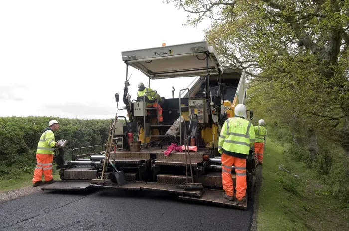 Framed Print : Road resurfacing work repairing potholes Framed Print : Road resurfacing work repairing potholes