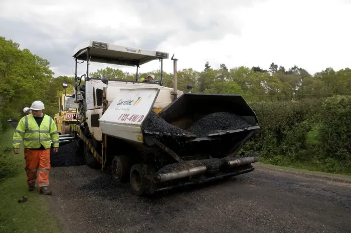 Framed Print : Road resurfacing work repairing potholes Framed Print : Road resurfacing work repairing potholes