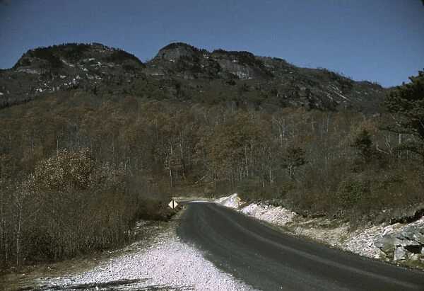 The road along the Skyline Drive, with a light snowfall in the rocks beside, Virginia, ca. 1940. Creator: Jack Delano