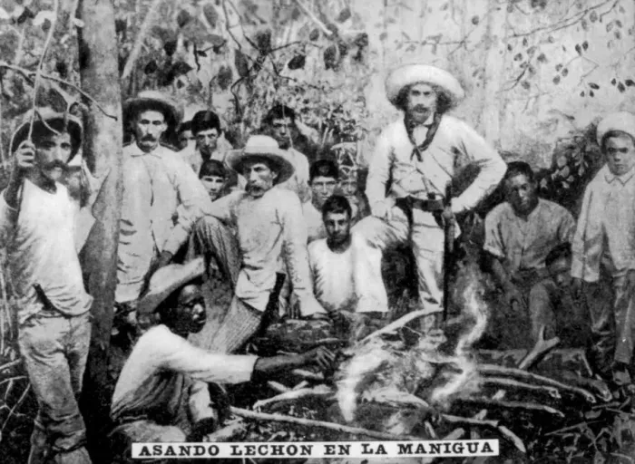 Framed Print : Roasting pig in the jungle, Cuba, (c1910) Framed Print : Roasting pig in the jungle, Cuba, (c1910)