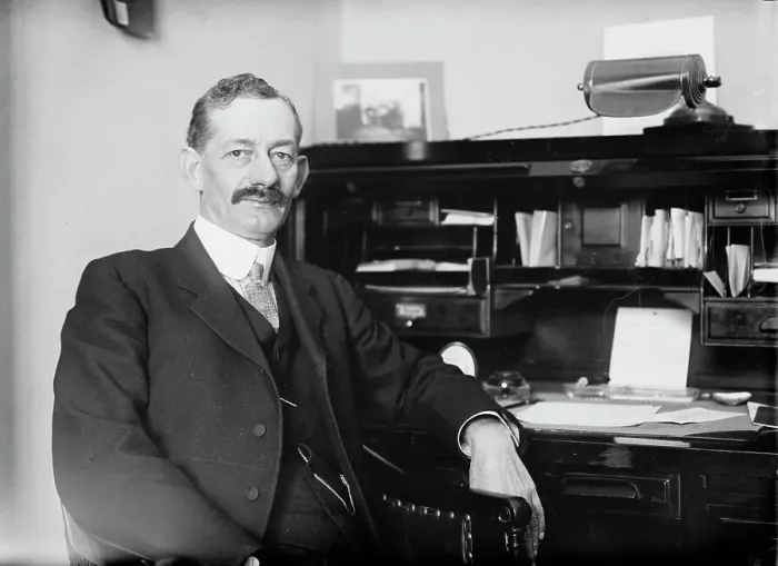 Framed Print : Robt. N. Page seated at desk, 1916. Creator: Bain News Service