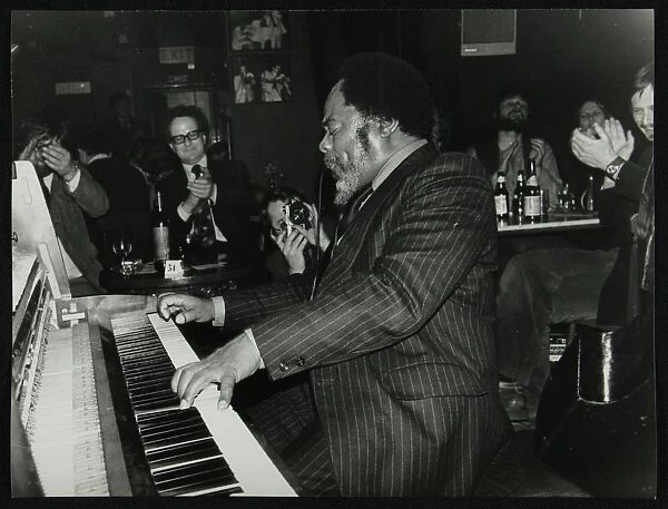 Roland Hanna playing the piano before an appreciative audience, 1980