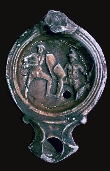 Roman clay lamp with design of gladiators, 3rd century