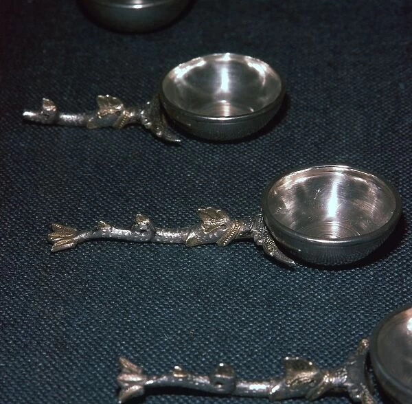 Roman silver and gilt ladles with handles cast in the form of dolphins, 4th century