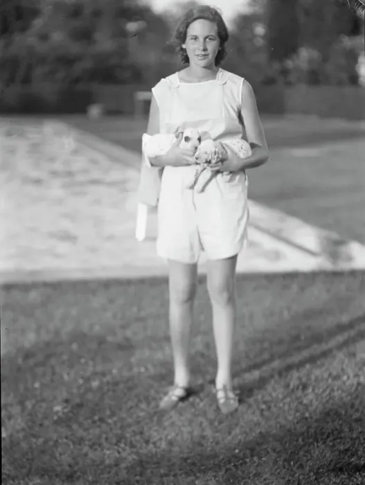 Framed Print : Rossbach, Miss, holding puppies, standing outdoors, 1932 June 30. Creator: Arnold Genthe Framed Print : Rossbach, Miss, holding puppies, standing outdoors, 1932 June 30. Creator: Arnold Genthe