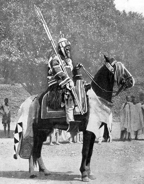 Royal bodyguard in ancient armour, northern Nigeria, 1936. Artist: Wide World Photos