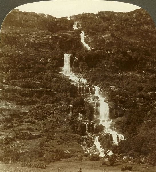 Rustoen Falls, as they come out of the sky, above Rustoefjeld heights, Norway, c1905
