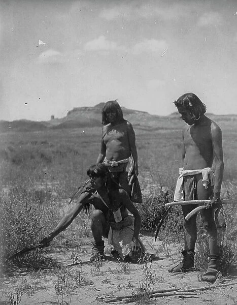 Me Sa Tawa catching snakes-Hopi, c1907. Creator: Edward Sheriff Curtis