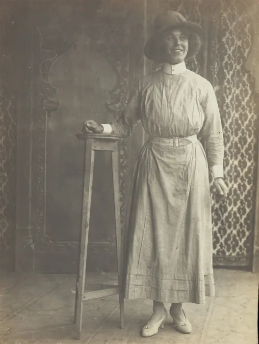 Framed Print : A sailor in drag leans on a high stool, in front of patterned scenery, (between 1910 and 1919?). Creator: Unknown Framed Print : A sailor in drag leans on a high stool, in front of patterned scenery, (between 1910 and 1919?). Creator: Unknown