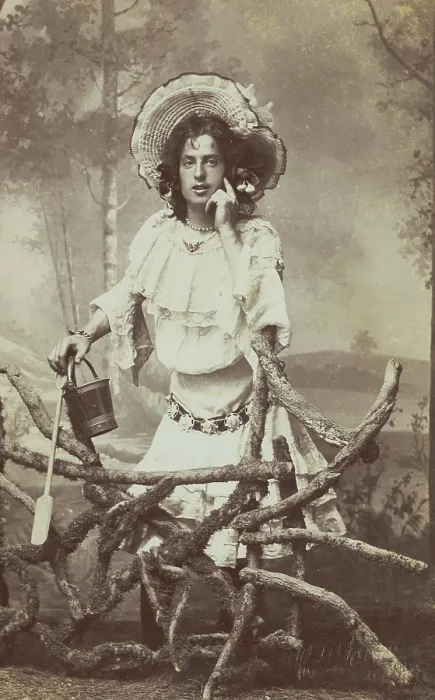 Framed Print : A sailor in drag posed behind a wooden fence, 1906. Creator: Unknown Framed Print : A sailor in drag posed behind a wooden fence, 1906. Creator: Unknown