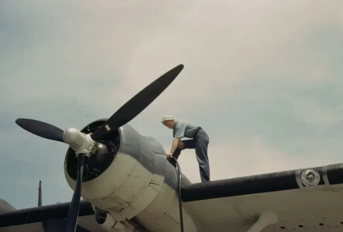 Framed Print : Sailor mechanic fueling a plane at the Naval Air Base, Corpus Christi, Texas, 1942. Creator: Howard Hollem Framed Print : Sailor mechanic fueling a plane at the Naval Air Base, Corpus Christi, Texas, 1942. Creator: Howard Hollem