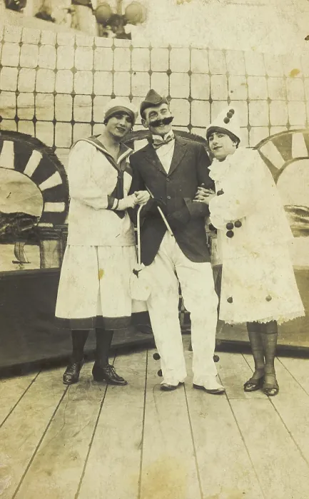 Framed Print : Three sailors, two in drag wearing pierrette costumes, pose on deck, c1910s. Creator: Unknown Framed Print : Three sailors, two in drag wearing pierrette costumes, pose on deck, c1910s. Creator: Unknown