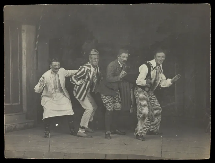 Framed Print : Sailors on stage in mid-pose, wearing a variety of costumes, [between 1910 and 1919?]. Creator: Unknown
