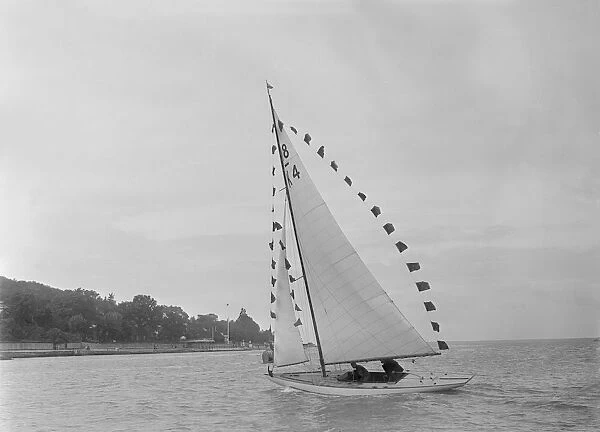 Saling yacht Asphodel (K5) with prize flags, 1922. Creator: Kirk & Sons of Cowes