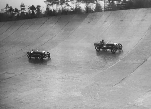 Two Salmsons racing on the banking at a BARC meeting, Brooklands, Surrey, 1931 Artist: Bill Brunell