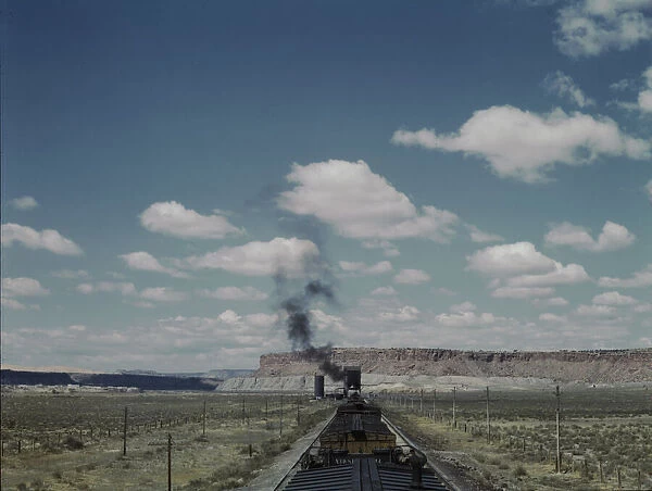Santa Fe R. R. train stopping for coal and water, Laguna, New Mexico, 1943. Creator: Jack Delano