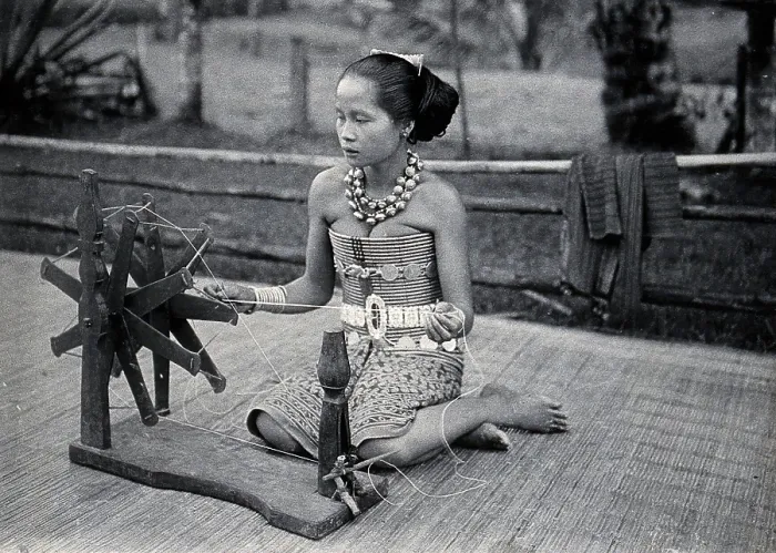 Framed Print : Sarawak: a girl spinning cotton into thread, c1900. Creator: Unknown Framed Print : Sarawak: a girl spinning cotton into thread, c1900. Creator: Unknown