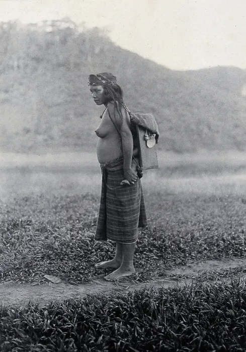 Framed Print : Sarawak: a Kayan woman carrying her child in a sling, c19th century. Creator: Unknown Framed Print : Sarawak: a Kayan woman carrying her child in a sling, c19th century. Creator: Unknown