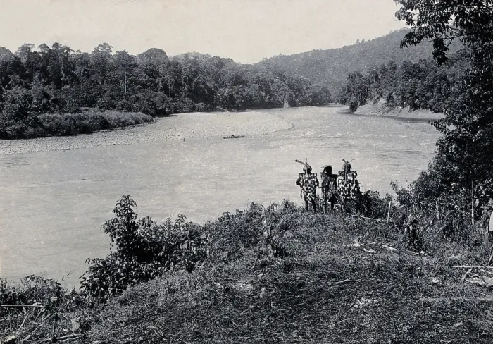 Framed Print : Sarawak: three men standing by the Baram River, c1900. Creator: Unknown Framed Print : Sarawak: three men standing by the Baram River, c1900. Creator: Unknown