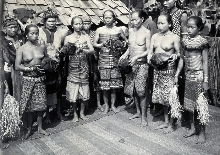 Framed Print : Sarawak: Sea Dayak men at a head feast, c1900. Creator: Unknown Framed Print : Sarawak: Sea Dayak men at a head feast, c1900. Creator: Unknown