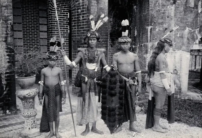 Framed Print : Sarawak: Sea Dayaks with weapons and head-dresses, c1900. Creator: Unknown Framed Print : Sarawak: Sea Dayaks with weapons and head-dresses, c1900. Creator: Unknown