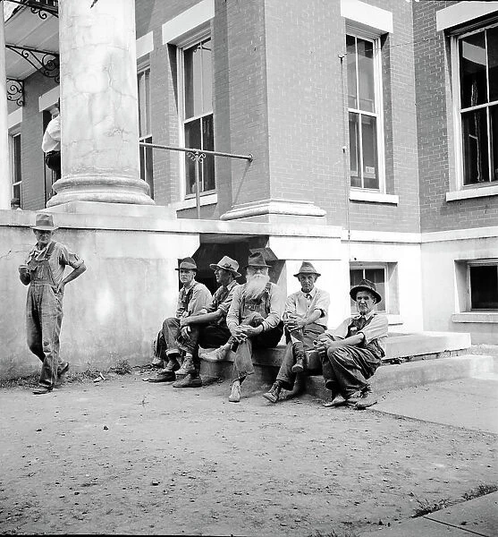 Saturday afternoon in front of the courthouse, Greenville [i.e. Greeneville], Tennessee, 1936. Creator: Dorothea Lange