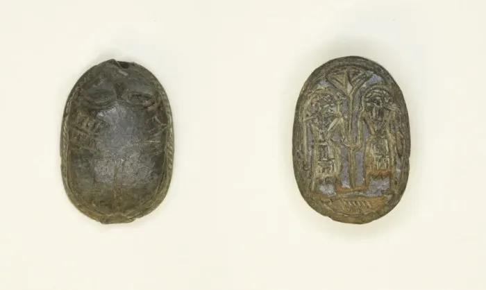 Framed Print : Scaraboid: Face Motif on Top; Two Figures Holding Flower on Base, Egypt Framed Print : Scaraboid: Face Motif on Top; Two Figures Holding Flower on Base, Egypt