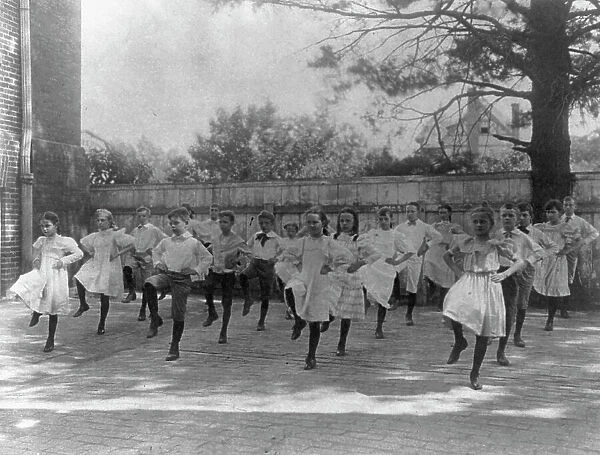 School children learning a dance in a school yard, Washington, D.C. (1899?). Creator: Frances Benjamin Johnston