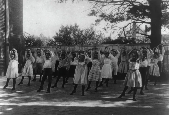Framed Print : School children learning a dance in a school yard, Washington, D.C. (1899?). Creator: Frances Benjamin Johnston Framed Print : School children learning a dance in a school yard, Washington, D.C. (1899?). Creator: Frances Benjamin Johnston